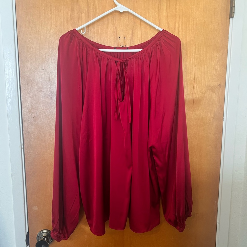 Red blouse, satin like material. No tag but fits like an xl